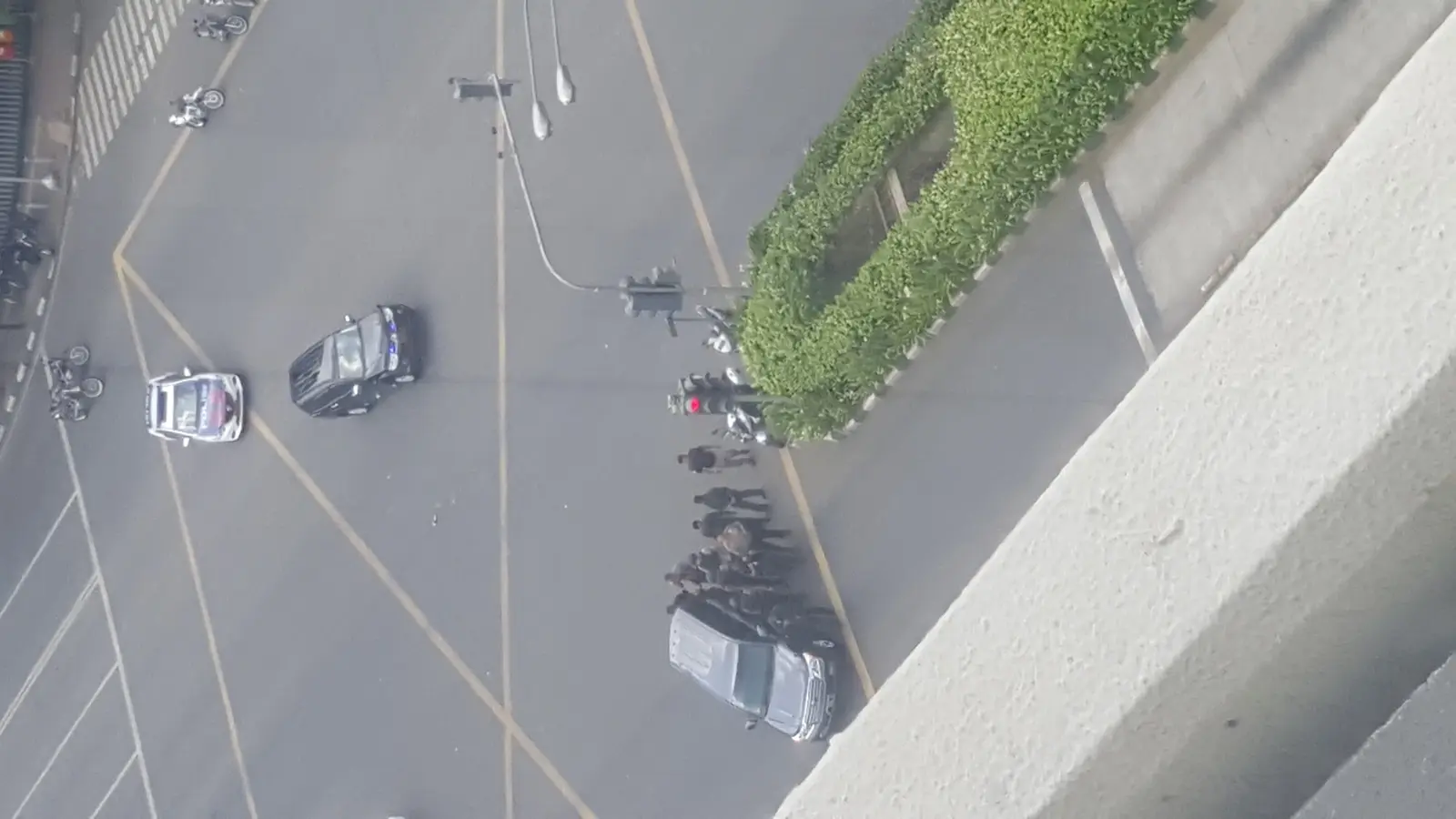 Armed police massing in the intersection during the gun battle